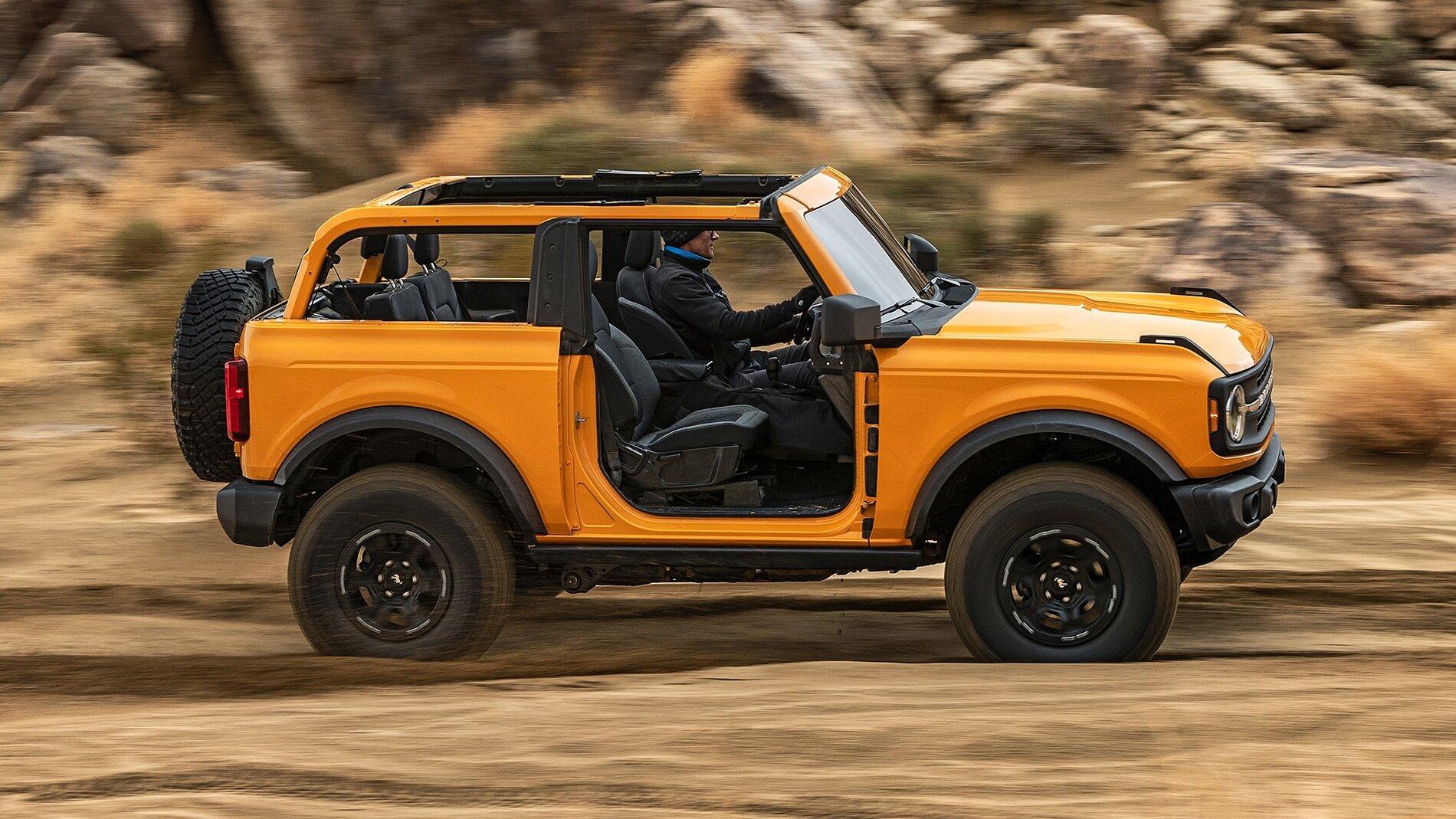 Ford Bronco Cyber Orange in person comparison. 2021-Ford-Bronco-side-in-motion-2