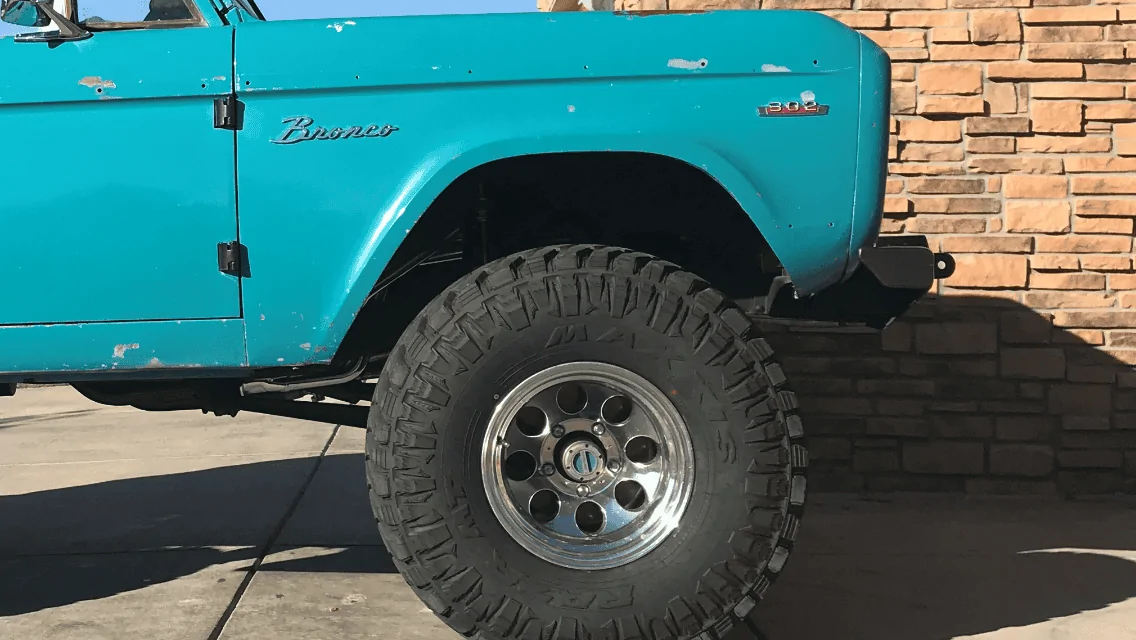 Ford Bronco Area 51 Black Diamond Sasquatch 4-Door at MAP showcase display right front fender cut