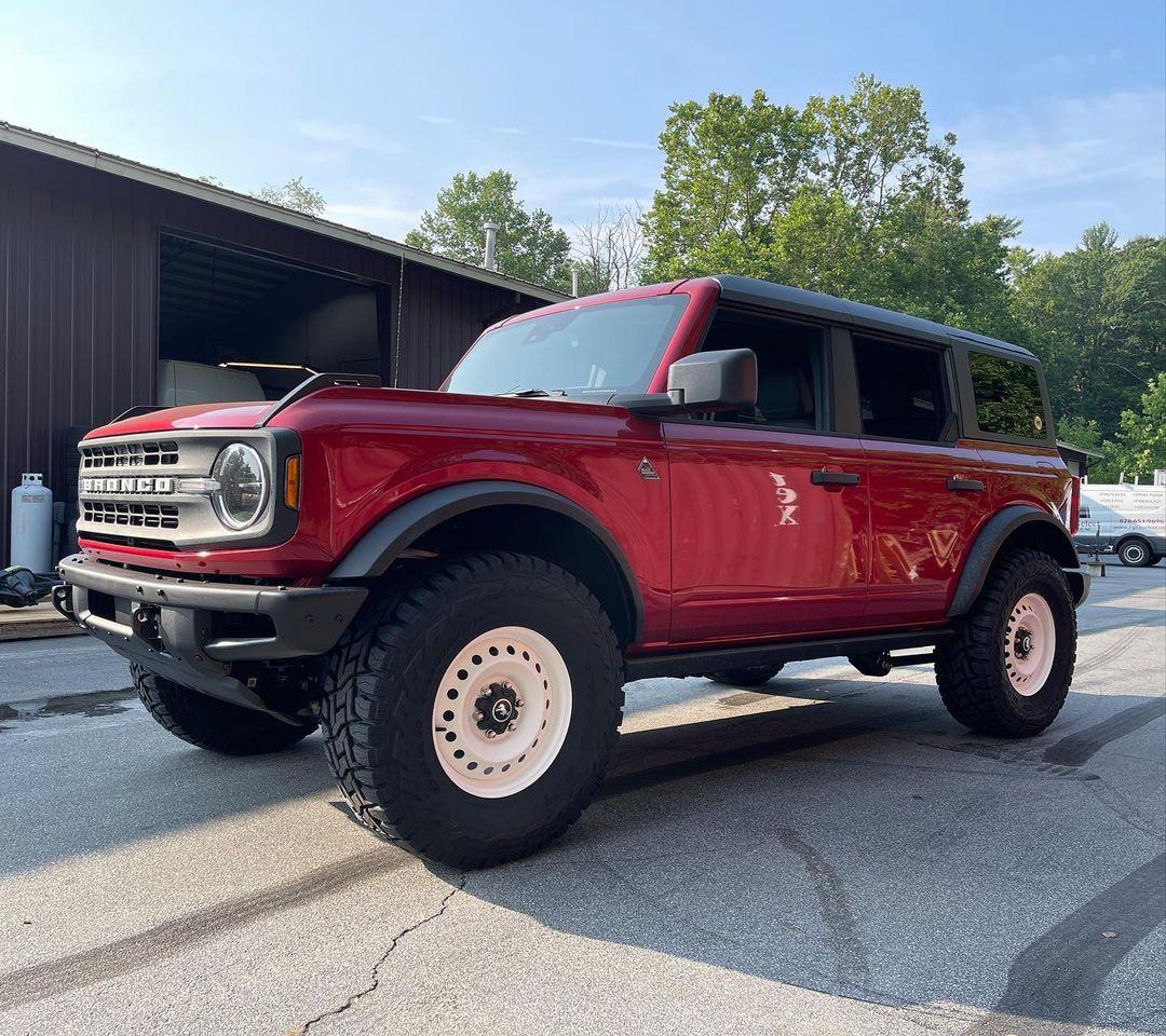 Ford Bronco RAPID RED Bronco Club white steel wheels heritage style on Bronco Black DSiamond