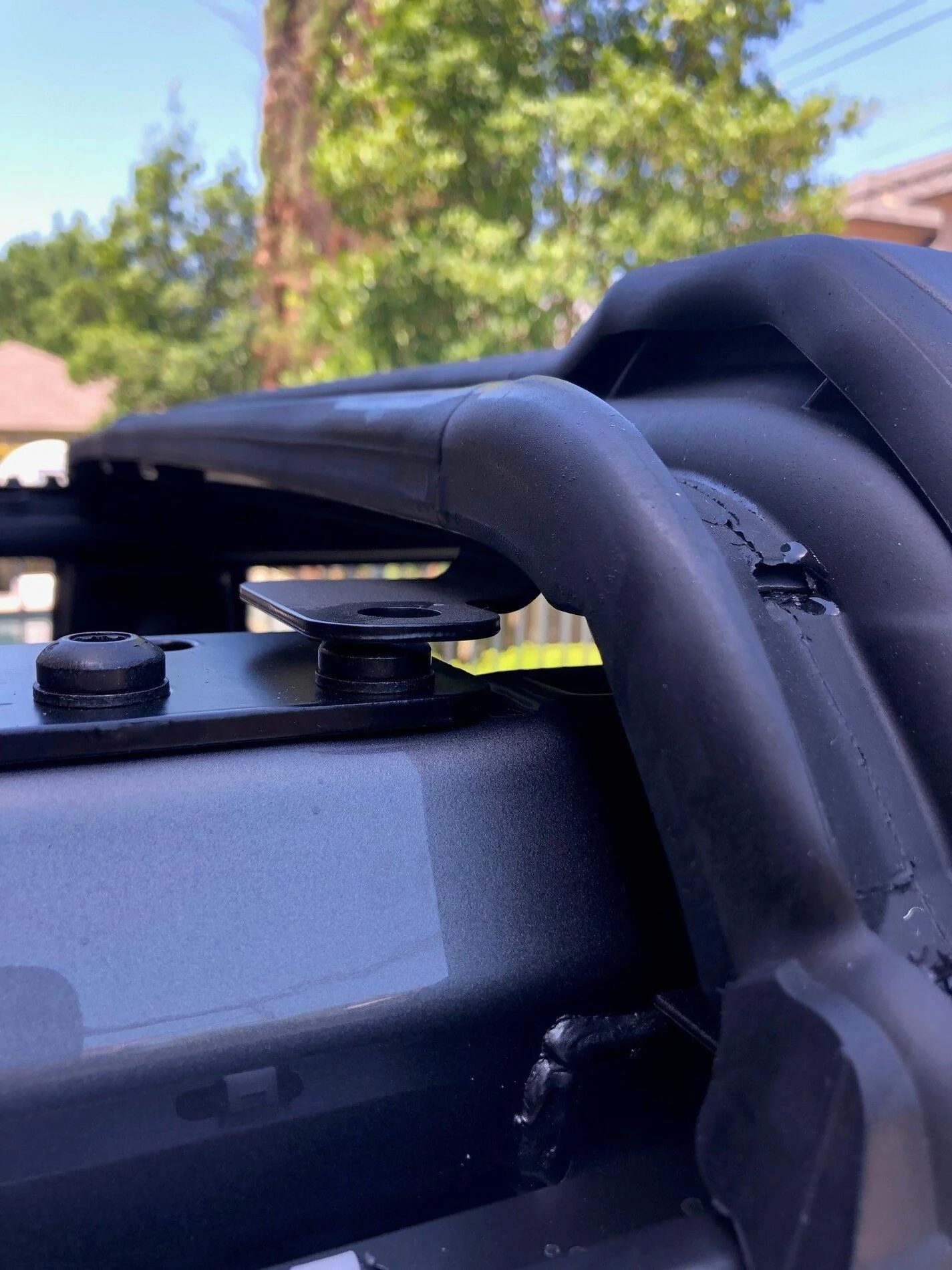 Ford Bronco MIC top installed incorrectly by factory (front bracket mounted on top screw rather than through it) Top 1