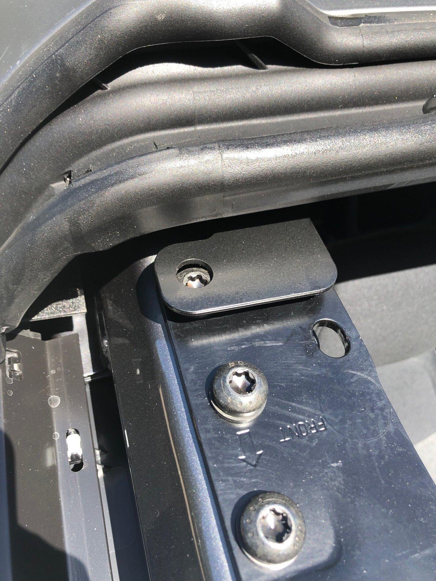 Ford Bronco MIC top installed incorrectly by factory (front bracket mounted on top screw rather than through it) Top above