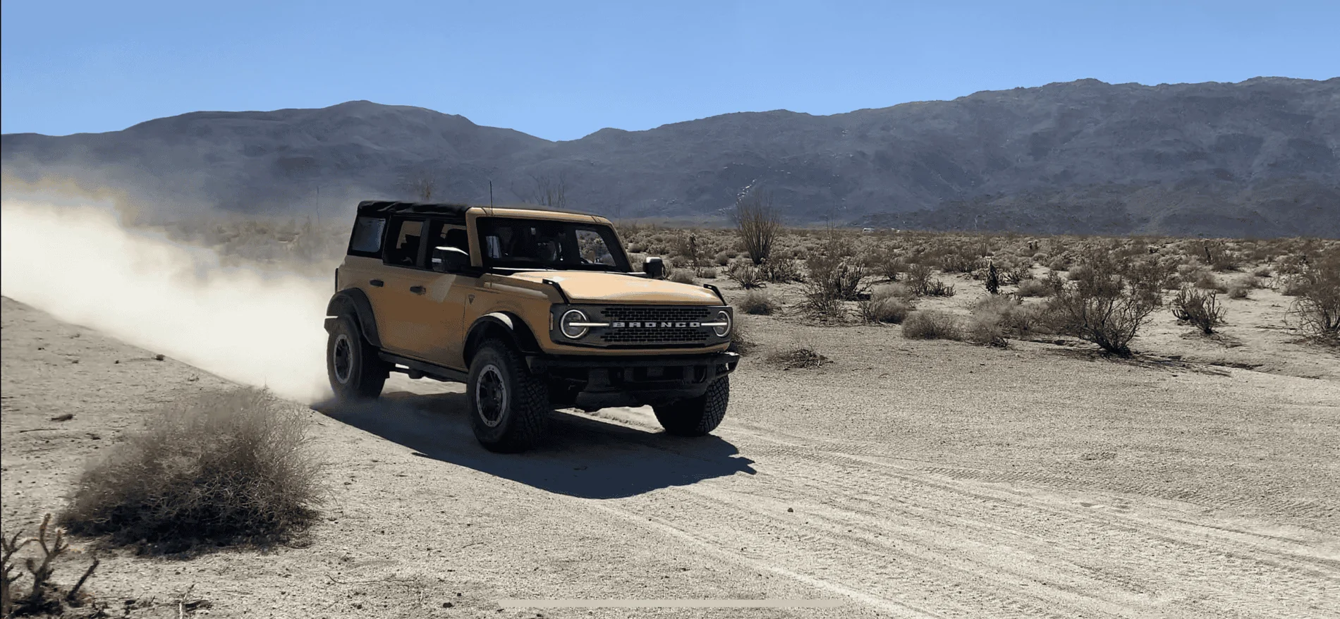 Ford Bronco Blasting through the desert in Badlands B1C20D34-5CAC-42A9-9AA7-F7E131C17528