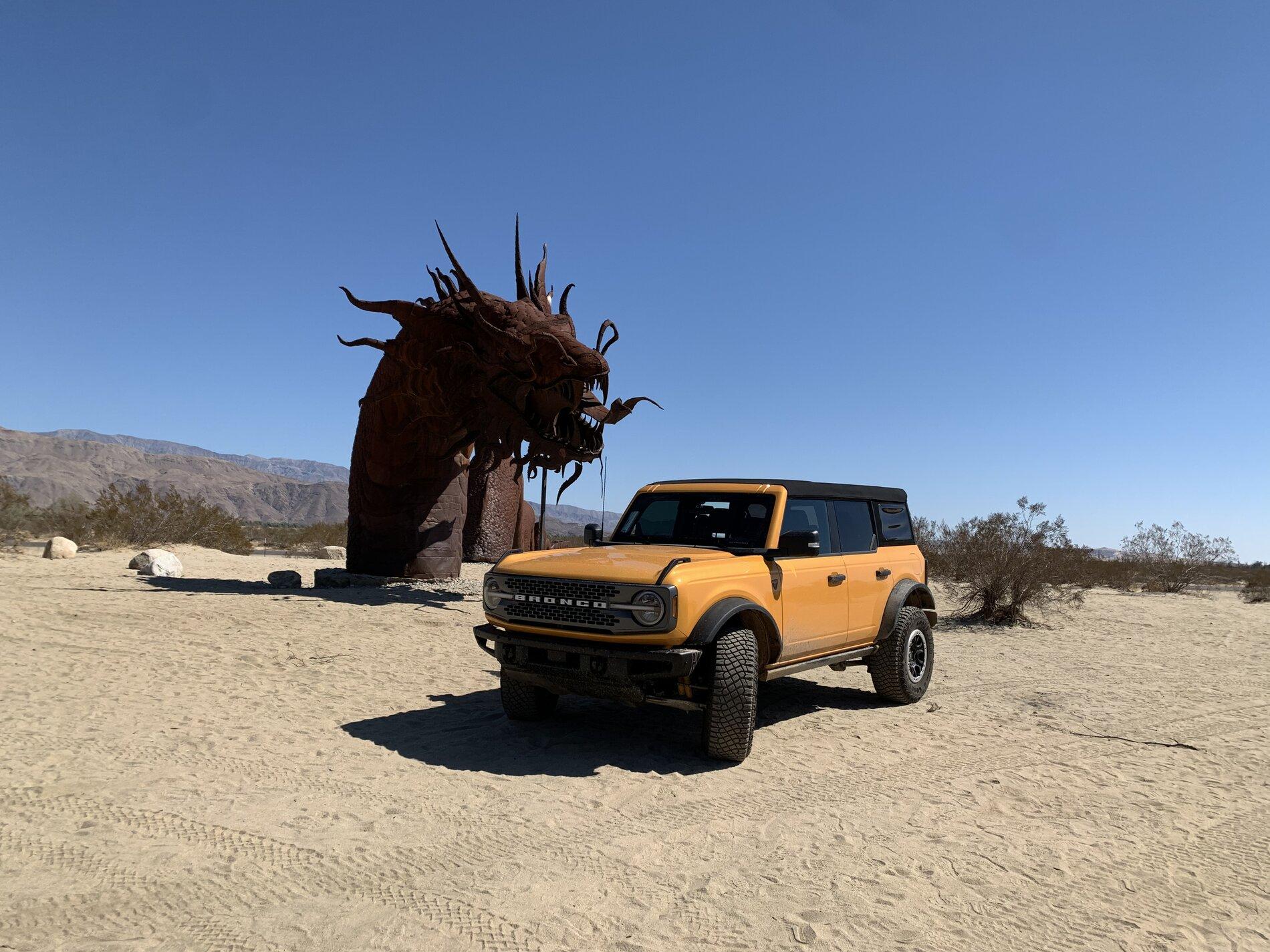 Ford Bronco Blasting through the desert in Badlands 01AB356A-174F-4CB5-8940-2E21CD7477EC