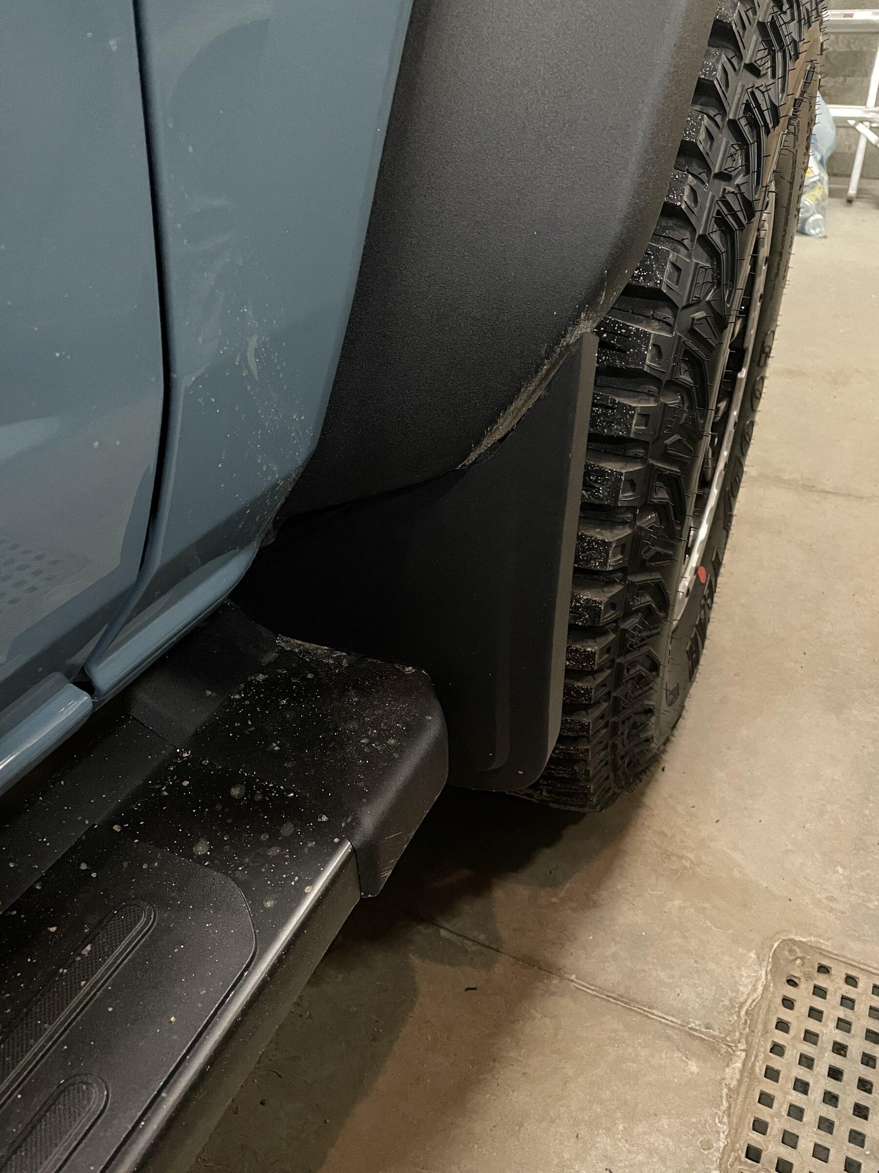 Ford Bronco Ford OEM Mud Flaps / Splash Guards trimmed to fit OBX Sasquatch with side steps E7909371-7386-4418-95FA-C87E41673A07