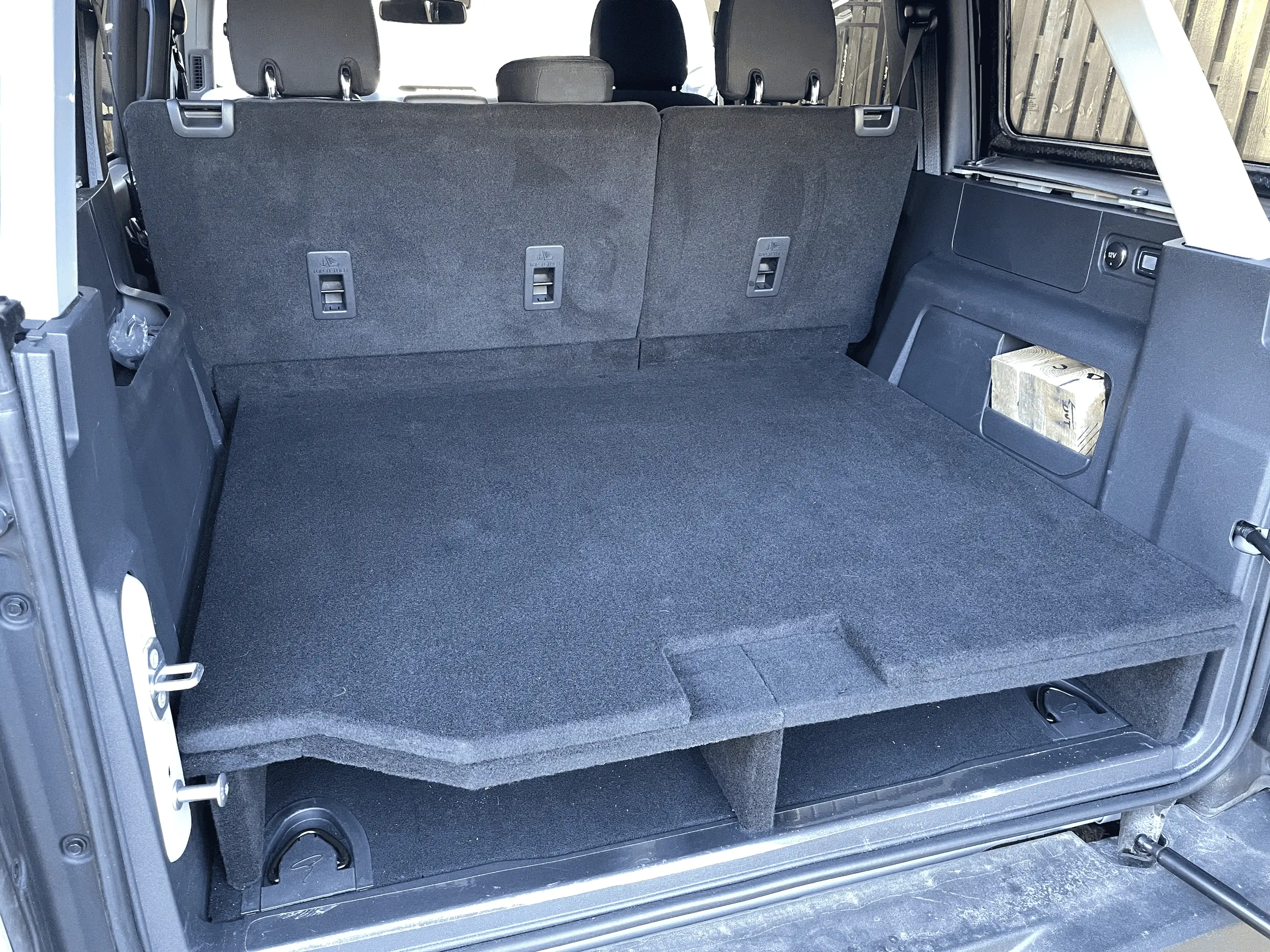 Ford Bronco 💤 Sleeping deck build in 4-door Bronco with photos, plans, and recommendations for a mattress and bedding setup. tempimagerbfmgu-png