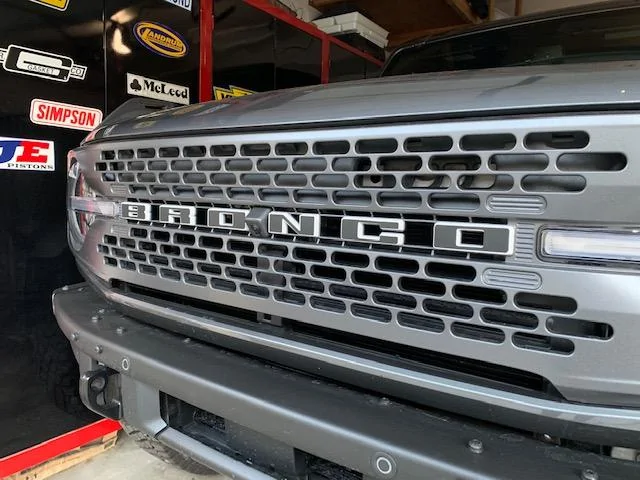 Ford Bronco Matte Black Hockey Stripes, Script Emblems Installed IMG_2104