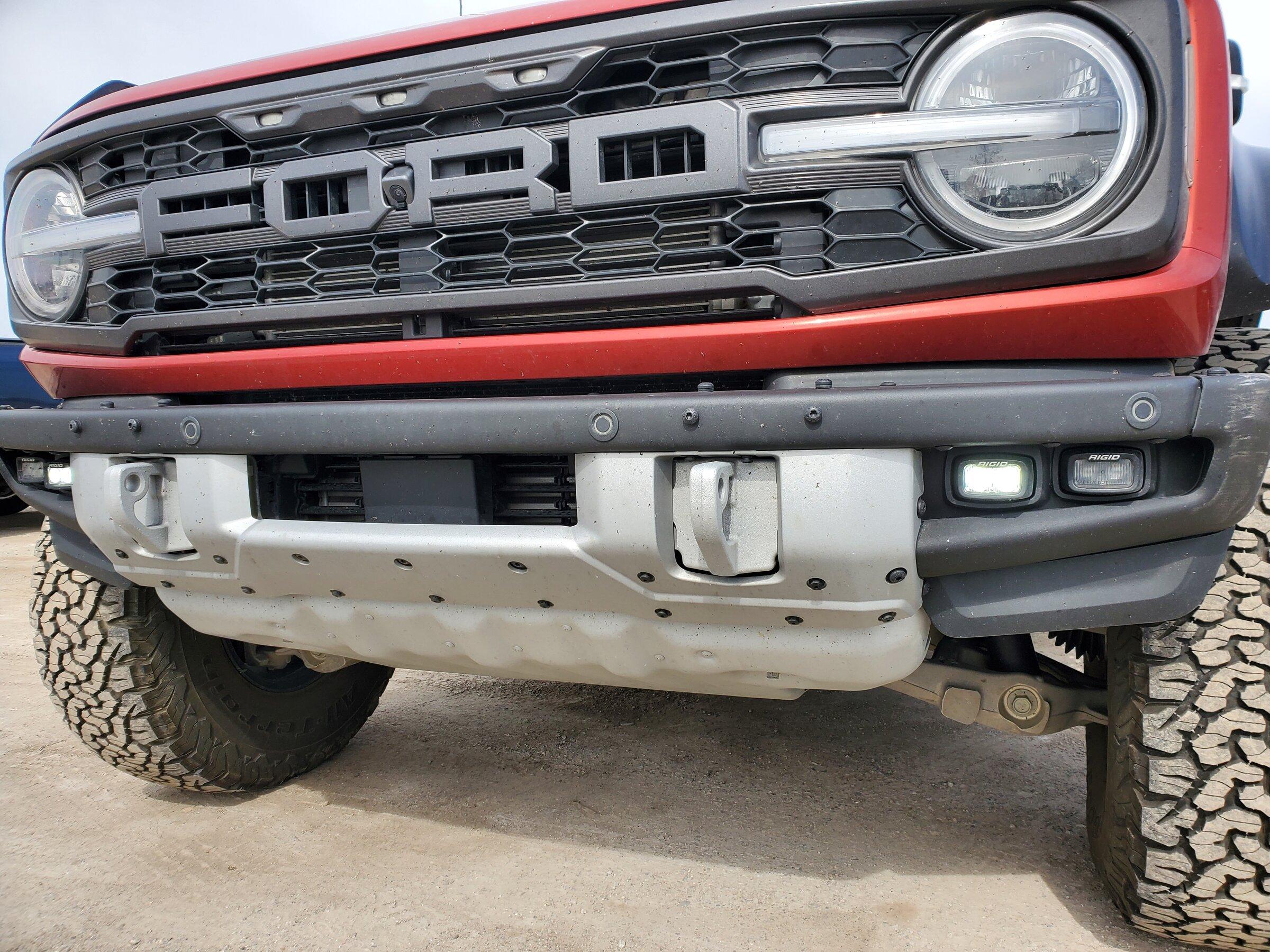 Ford Bronco 2 raptors in Port Huron today - Iconic Silver & Hot Pepper Red 20220430_103744