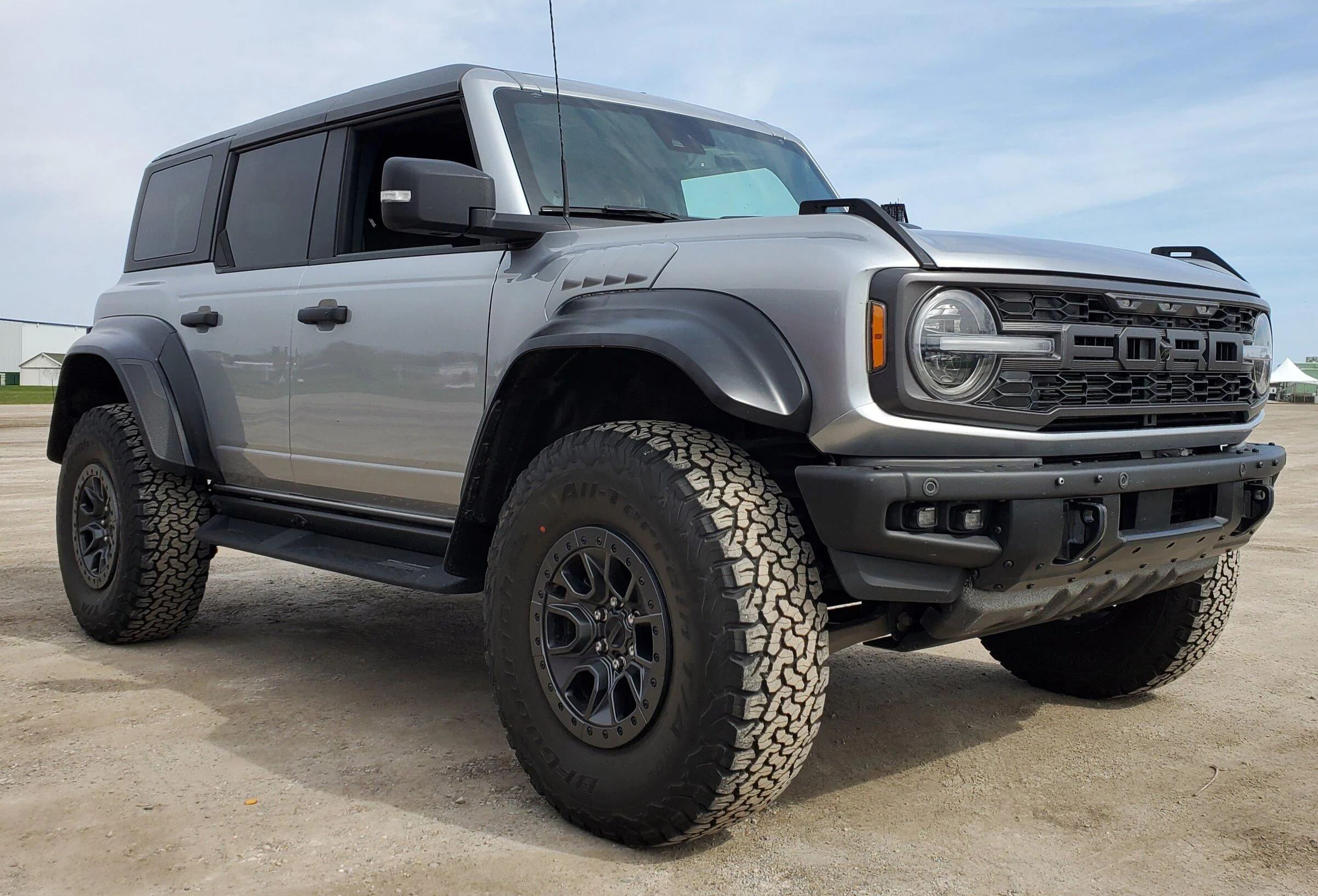 Ford Bronco 2 raptors in Port Huron today - Iconic Silver & Hot Pepper Red 20220430_103740