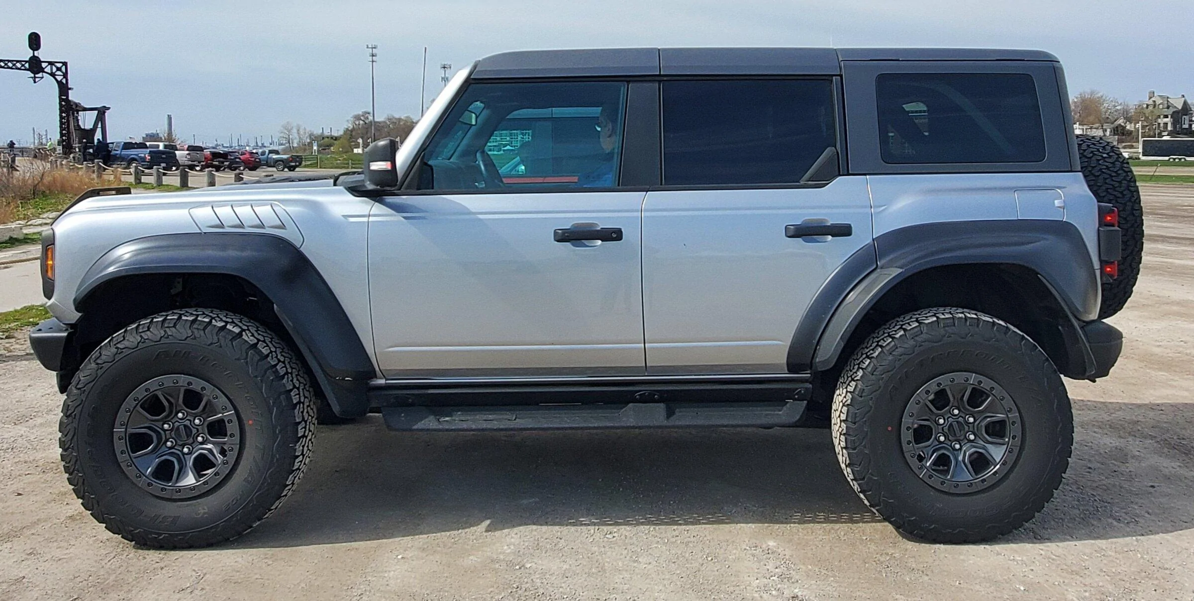 Ford Bronco 2 raptors in Port Huron today - Iconic Silver & Hot Pepper Red 20220430_103011