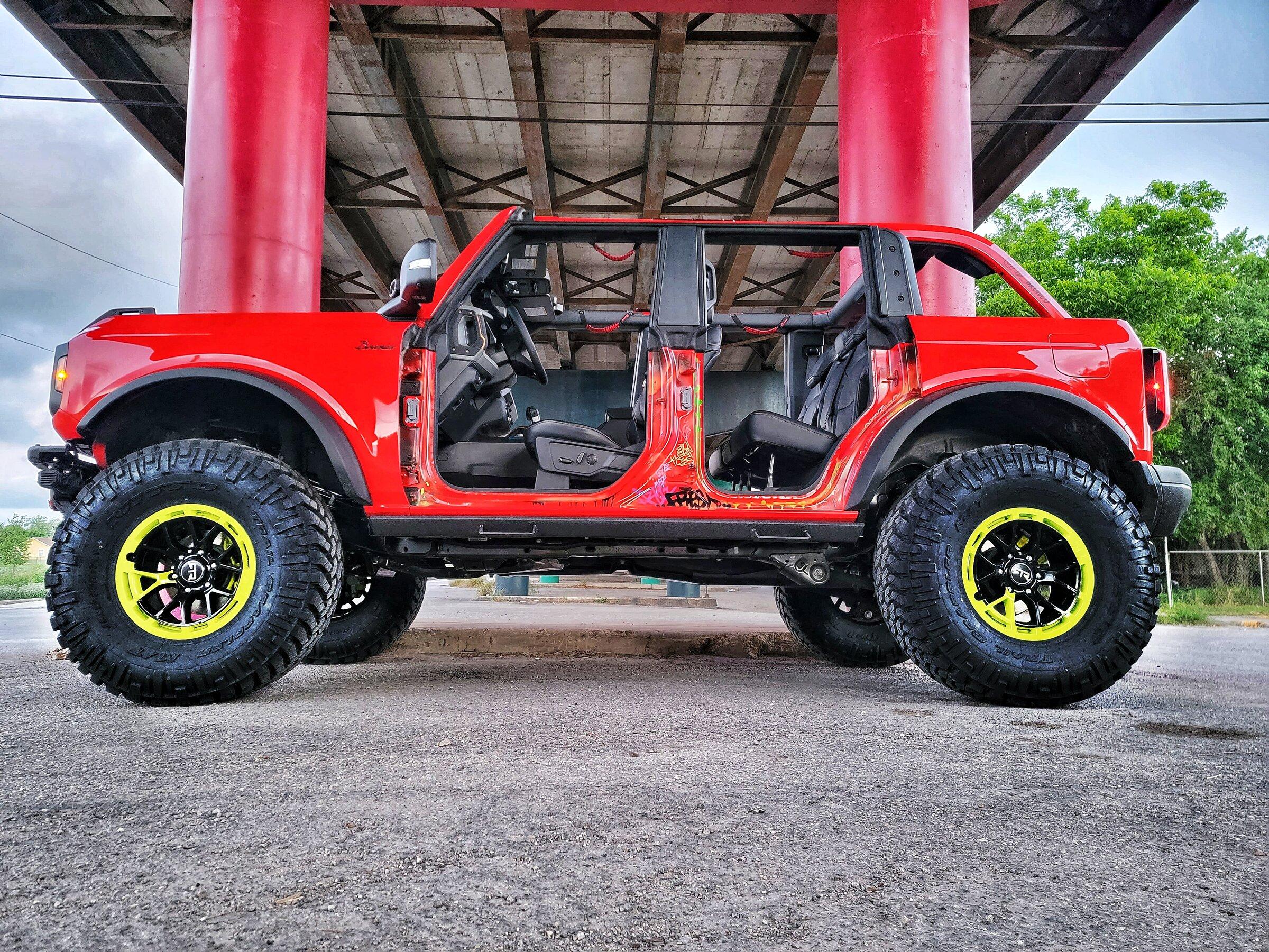 Ford Bronco My Badlands Race Red on 38's, 17" RTR wheels, 4.5" custom lift, custom steps & graffiti 20220513_063727-01