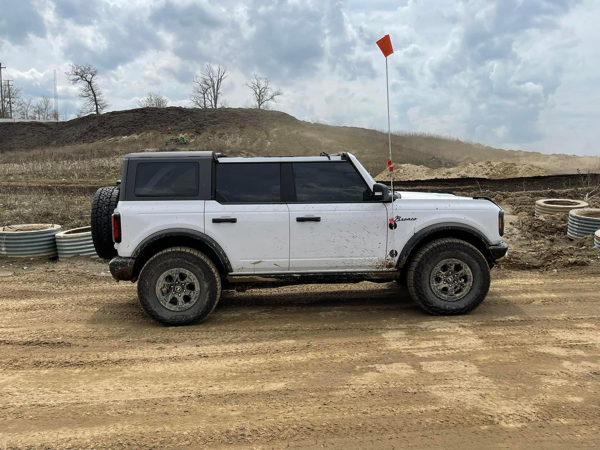 Ford Bronco Driving with the clamshell only side shot betty