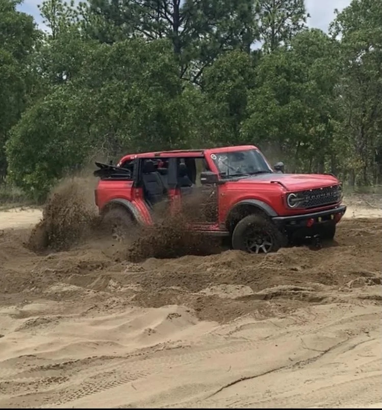 Ford Bronco RACE RED Bronco Club Sand pit trail turn assist