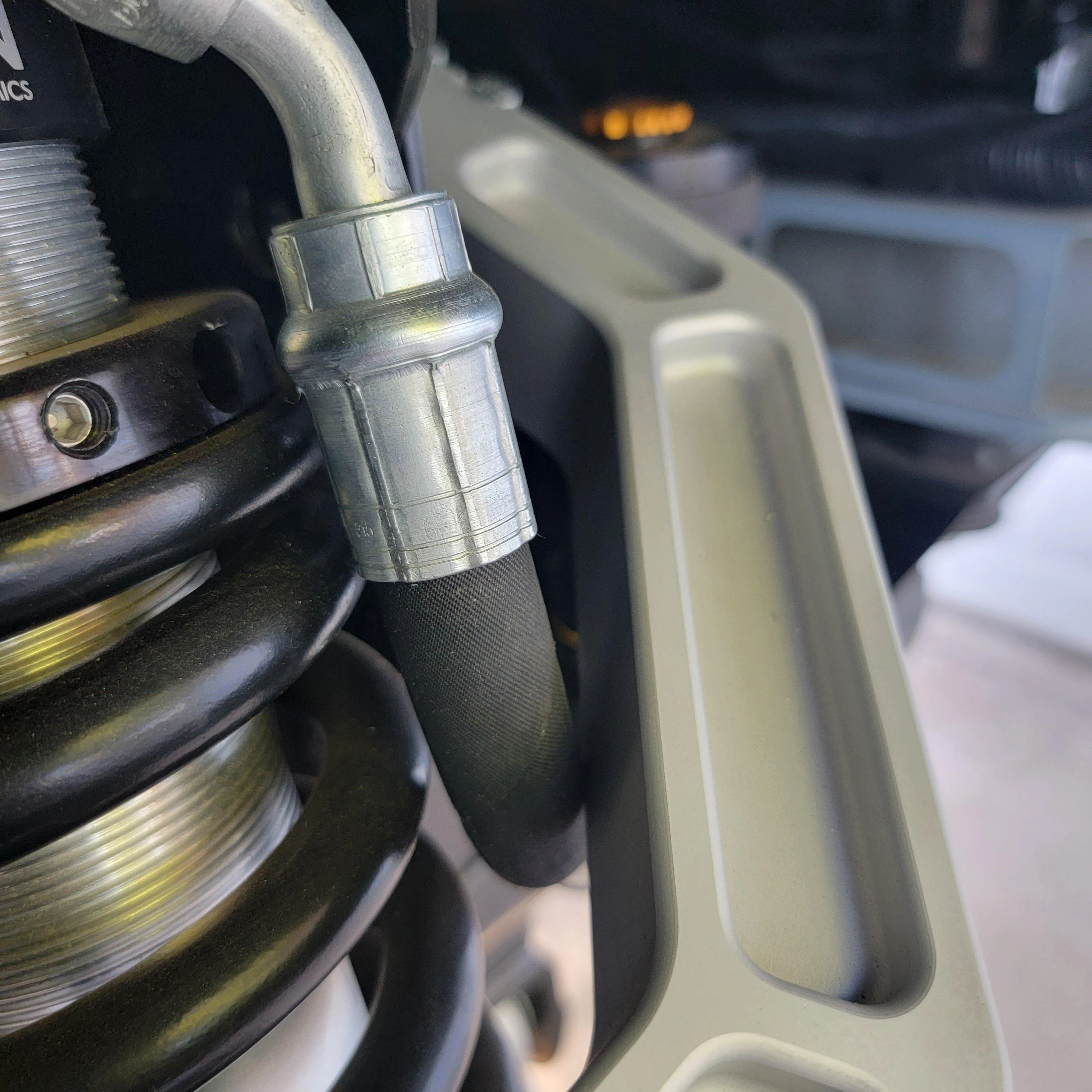 Ford Bronco Icon 2.5 adjustable coilover install (Self Squatch) ICON Front Passenger Res Hose Contact
