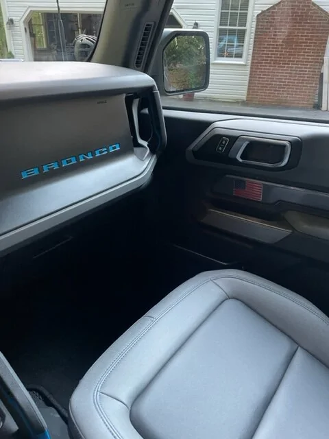 Ford Bronco got some interior door badges (2 door). passenger door flag