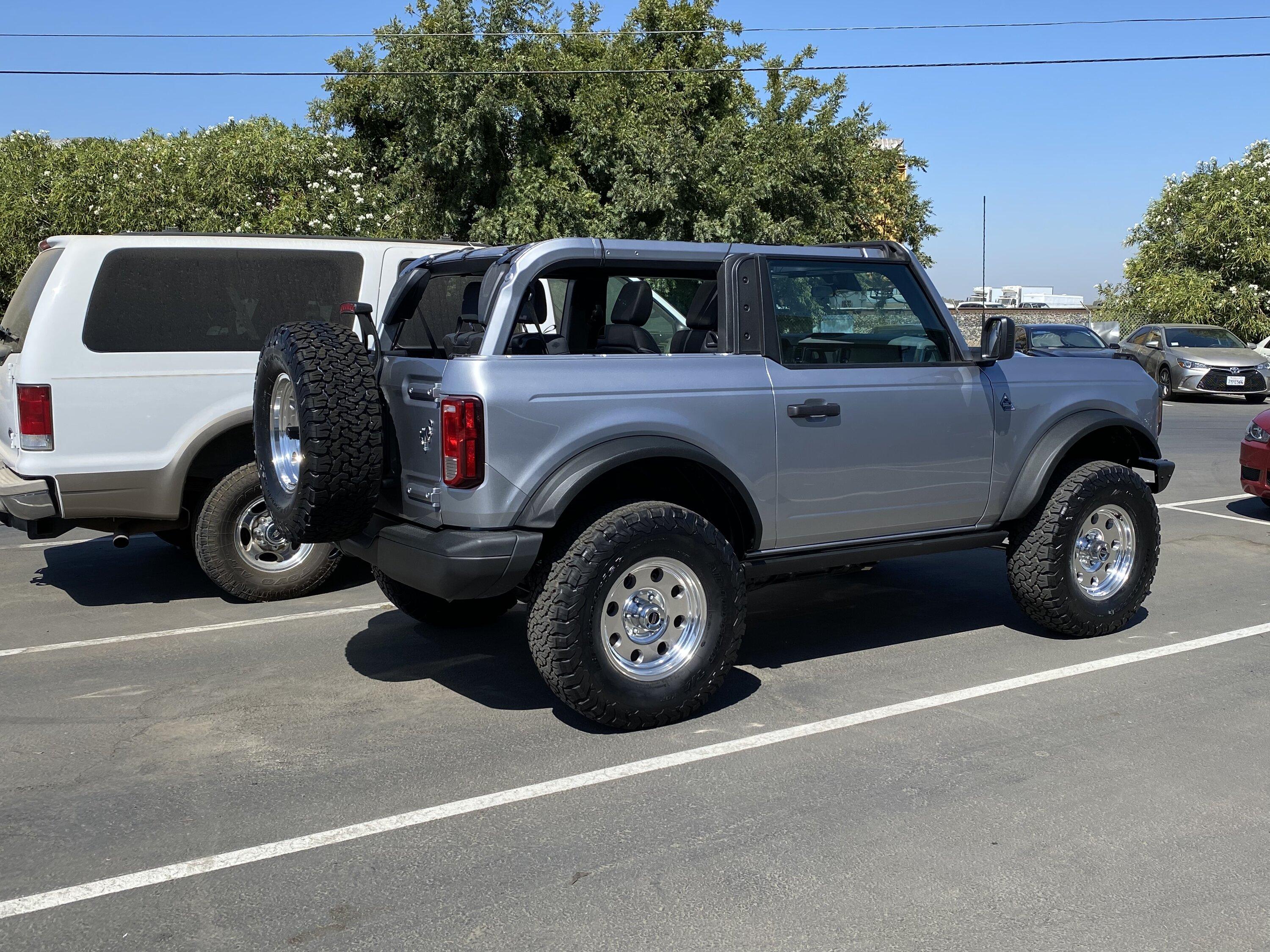 Ford Bronco Flicka, the 2 Door Iconic Silver Bronco on polished revolver mags wheels 81BD9D56-BACF-4810-BA16-46137D90F633