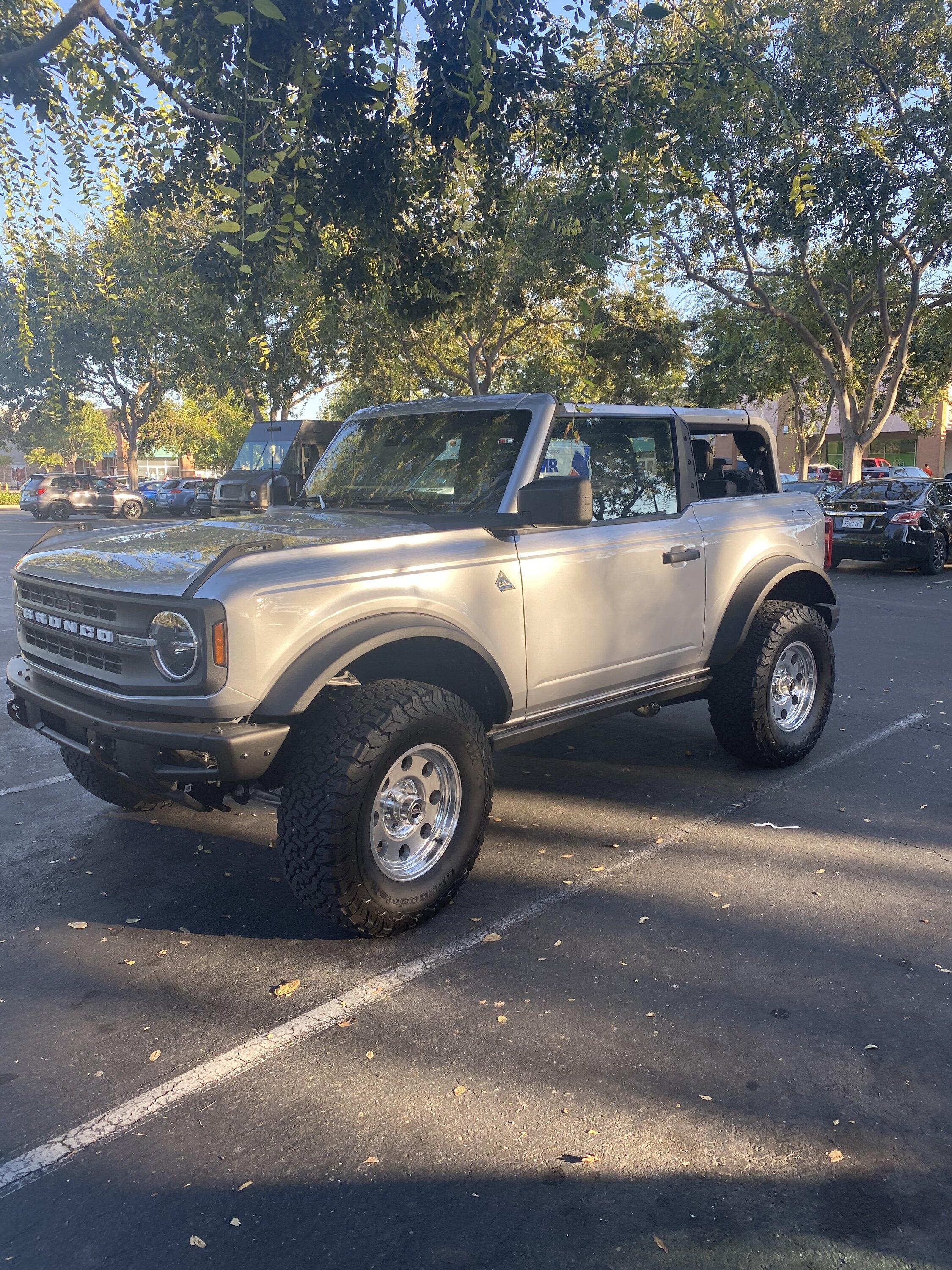 Ford Bronco Flicka, the 2 Door Iconic Silver Bronco on polished revolver mags wheels 9488B0CD-B2B8-4701-B2ED-978E908B479A