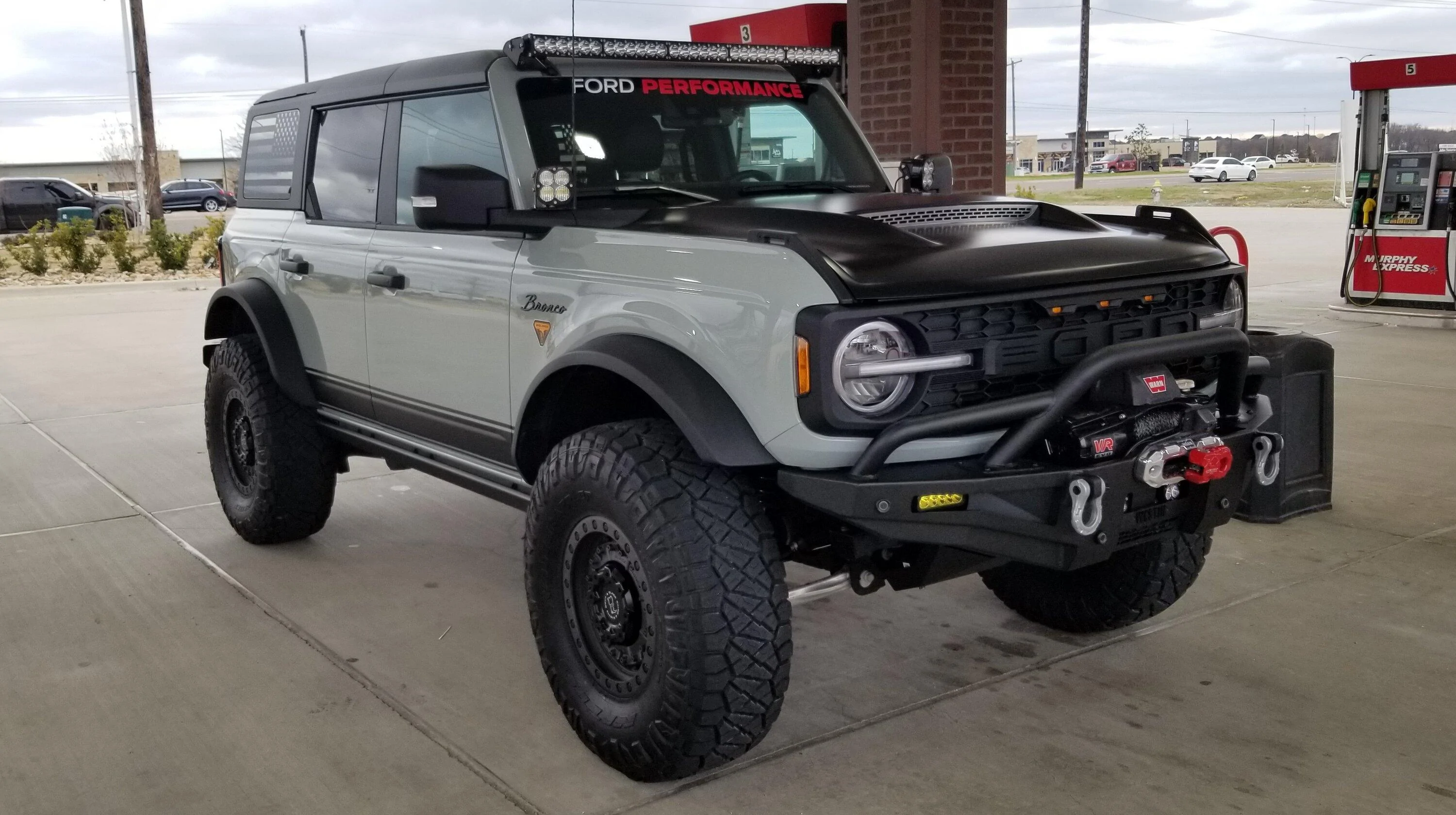 Ford Bronco CACTUS GRAY Bronco Club Bronco at Gas Station