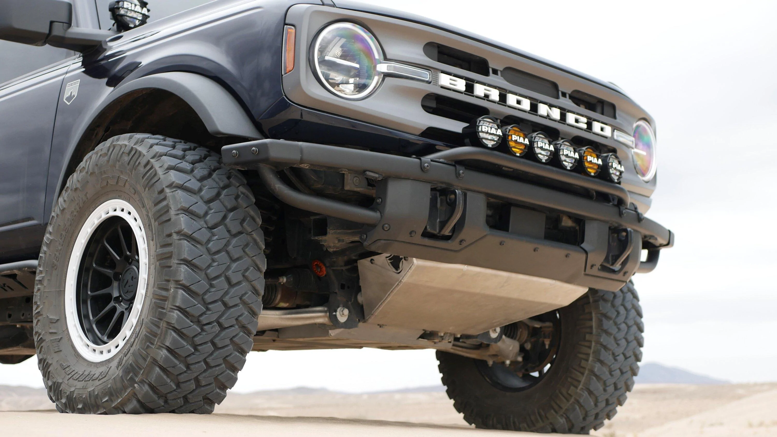 Ford Bronco LOBO Off-Road HNT Aluminum Front Skid Plate vs. Factory Front Skid 1010