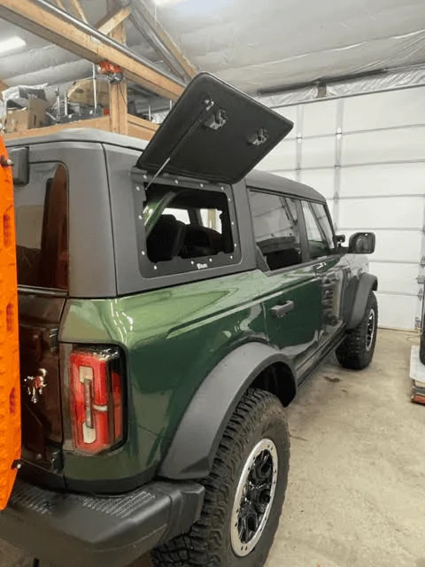 Ford Bronco Velox Gull Wing doors installed in MIC hard top 1680541736398