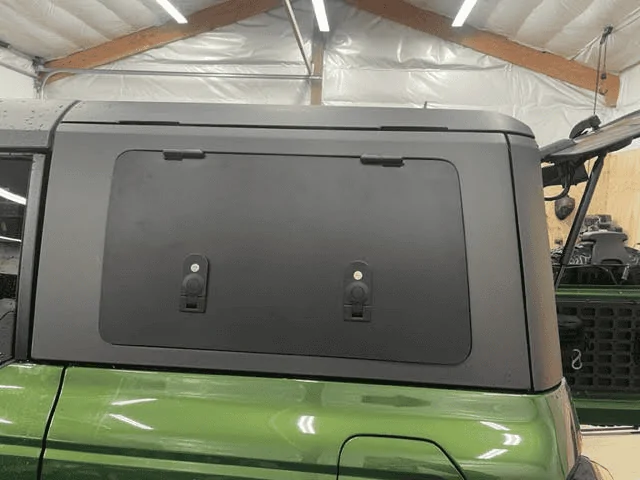 Ford Bronco Velox Gull Wing doors installed in MIC hard top 1680541869837
