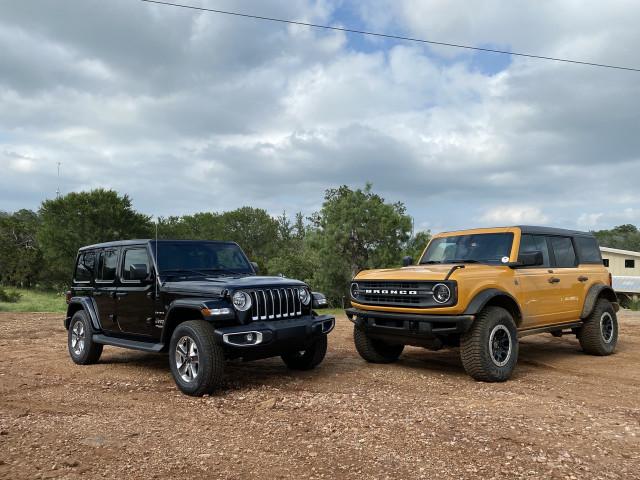 2021-jeep-wrangler-sahara-black-and-2021-ford-bronco-black-diamond-yellow_100797542_m.jpg