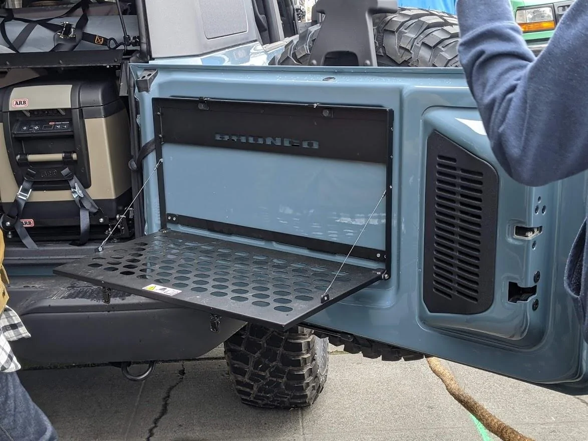 Ford Bronco Onboard door storage with sliding tailgate? Bronco Flip Down Tray