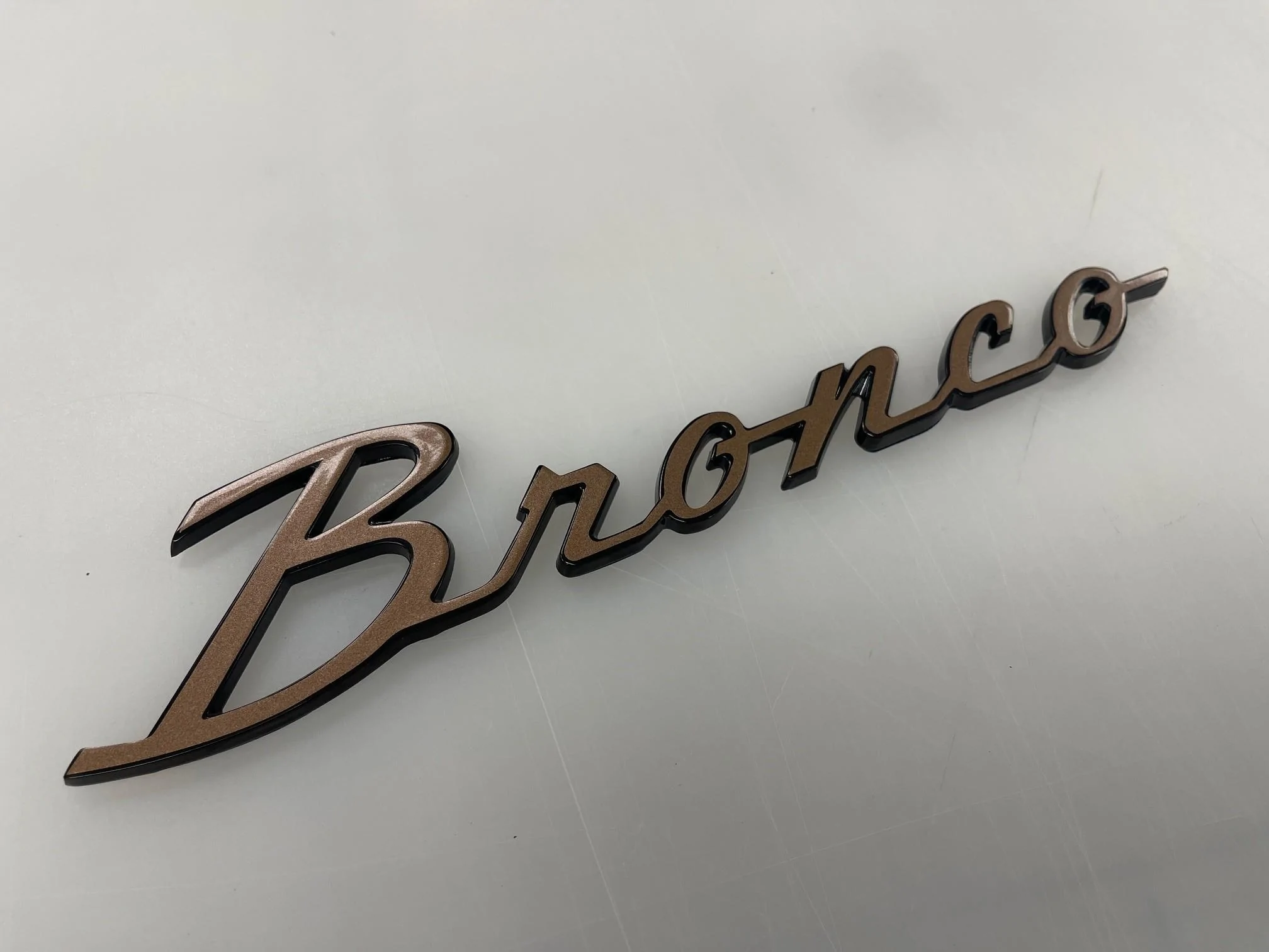 Ford Bronco Anyone find some Bronze Script Badges that match bronze Fuel Wheels? Overlay Bronz