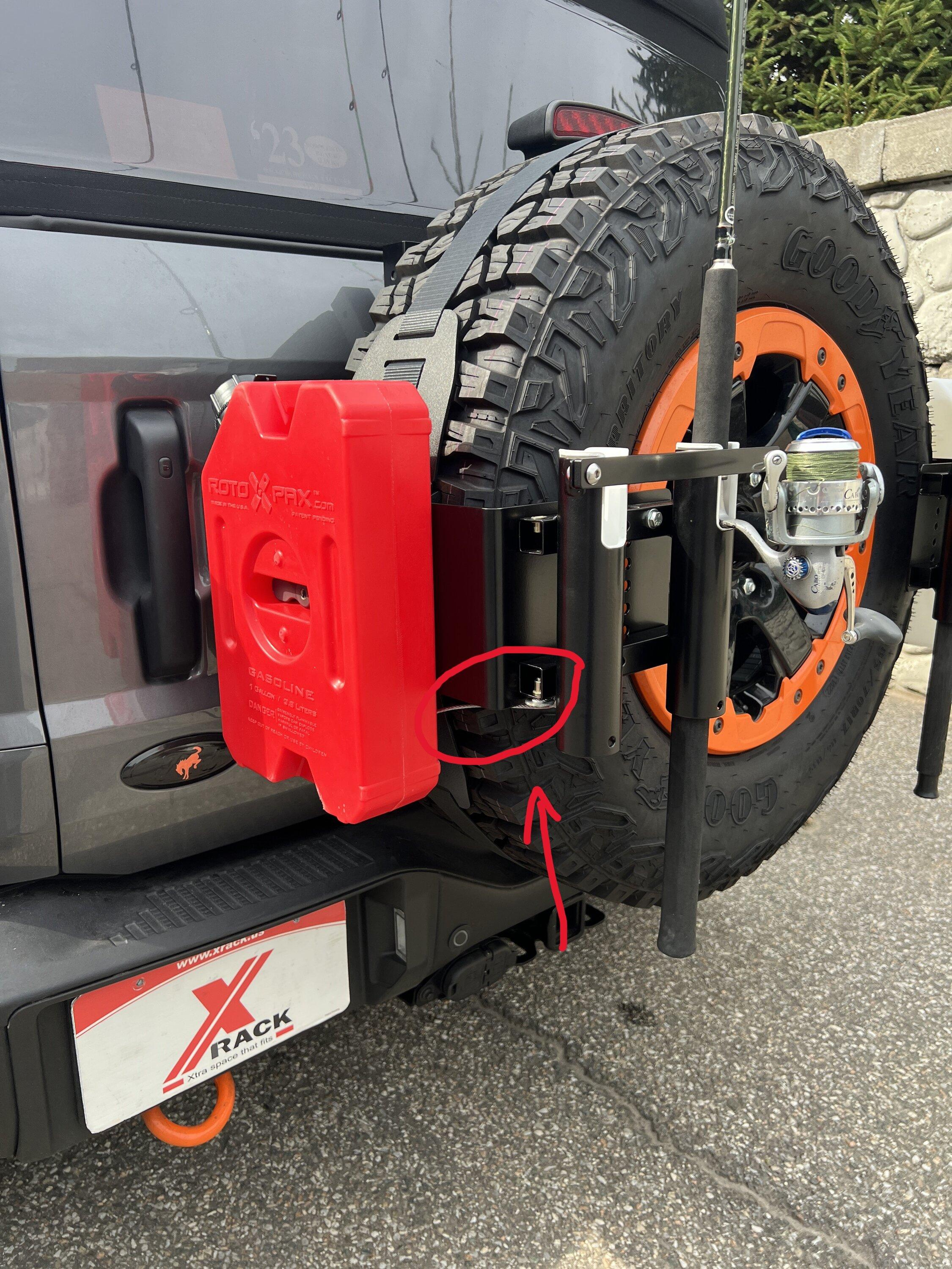 Ford Bronco New X-Rack Fishing Rod Holder modification for Rockslide Engineering EZ-Rack and Rotopax mounts lock cable highlight.JPG