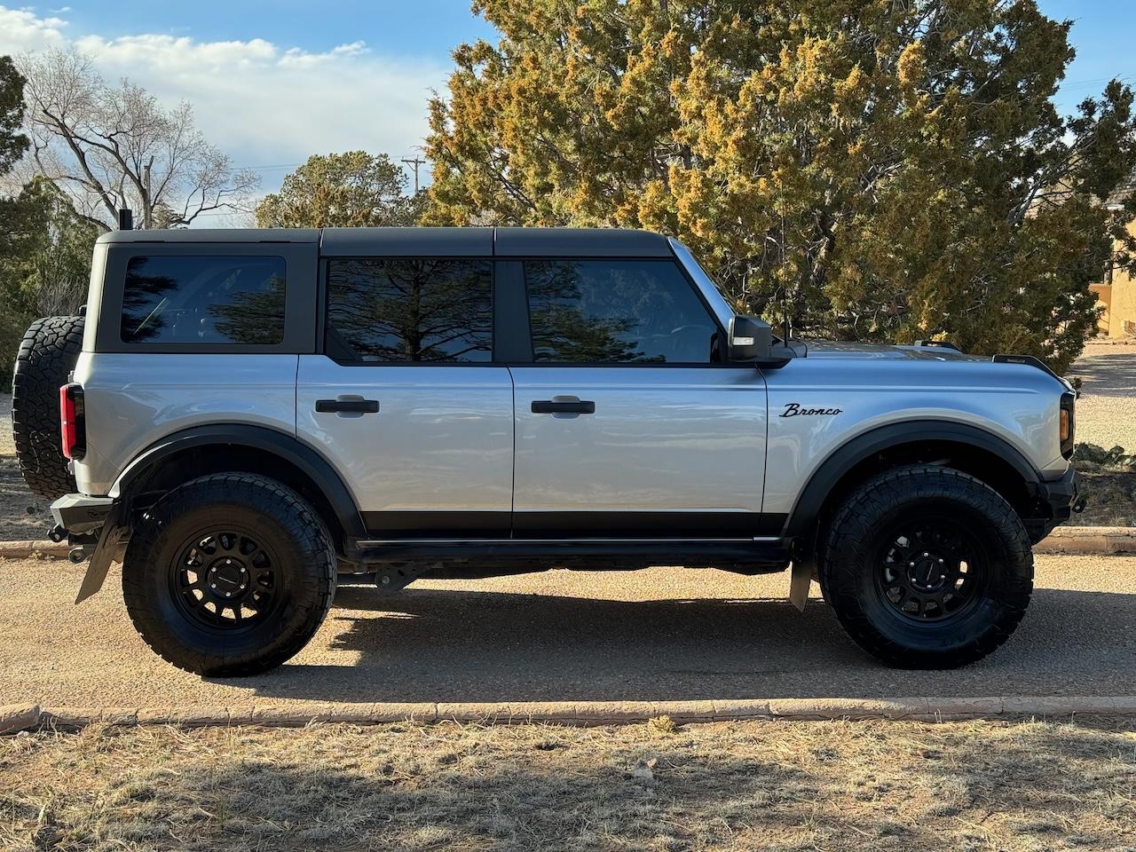 Ford Bronco Tejona the Wildtrak Method 703 matte black wheels on Iconic silver Bronco 