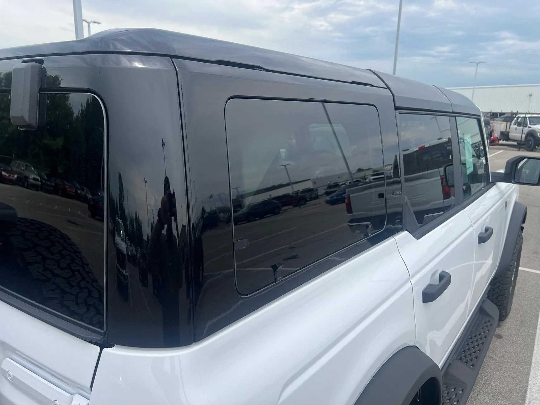 Ford Bronco Black Painted Hard top (+ Raptor style running boards) on 2024 Bronco at our dealership! IMG_5890