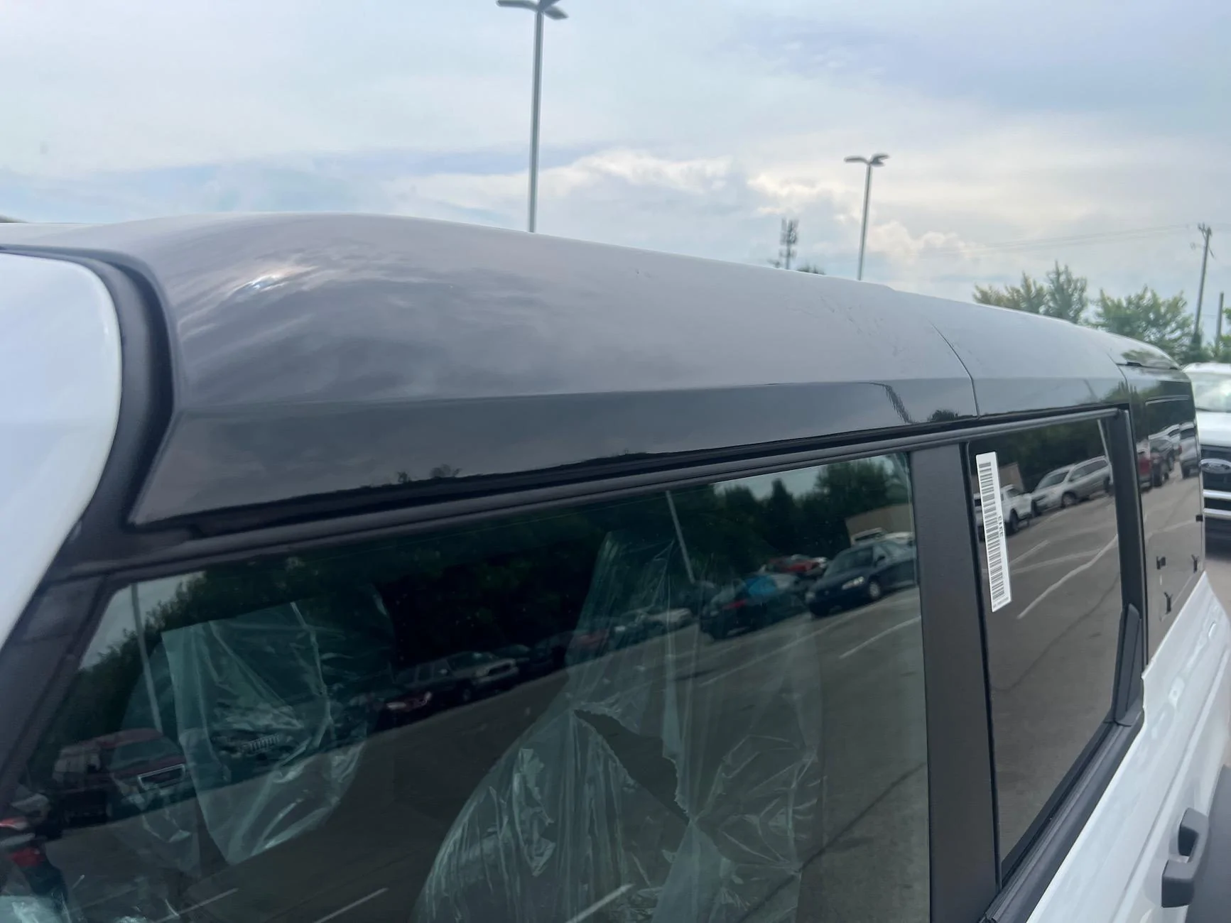 Ford Bronco Black Painted Hard top (+ Raptor style running boards) on 2024 Bronco at our dealership! IMG_5893
