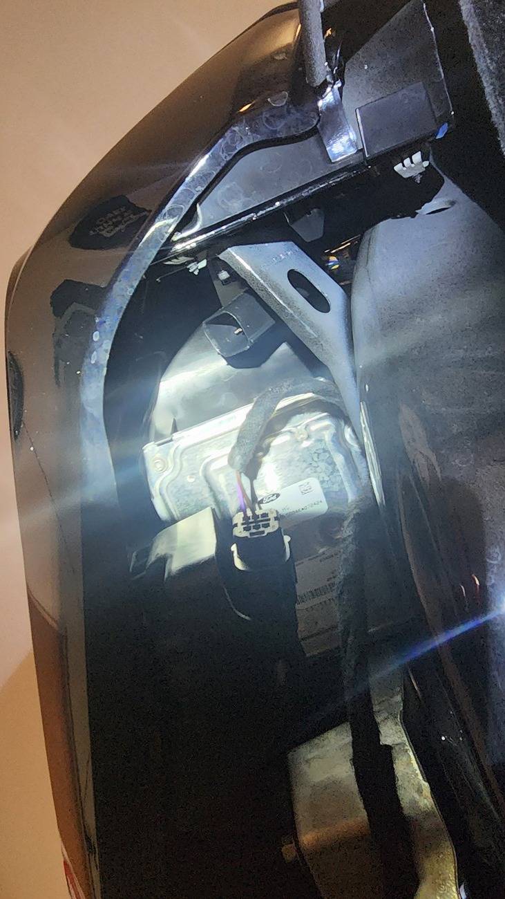 Ford Bronco Rough Country High Mount Winch Install Notes 3.1-Laying Down Looking Up at Bumper Connector Under Driver Headlight