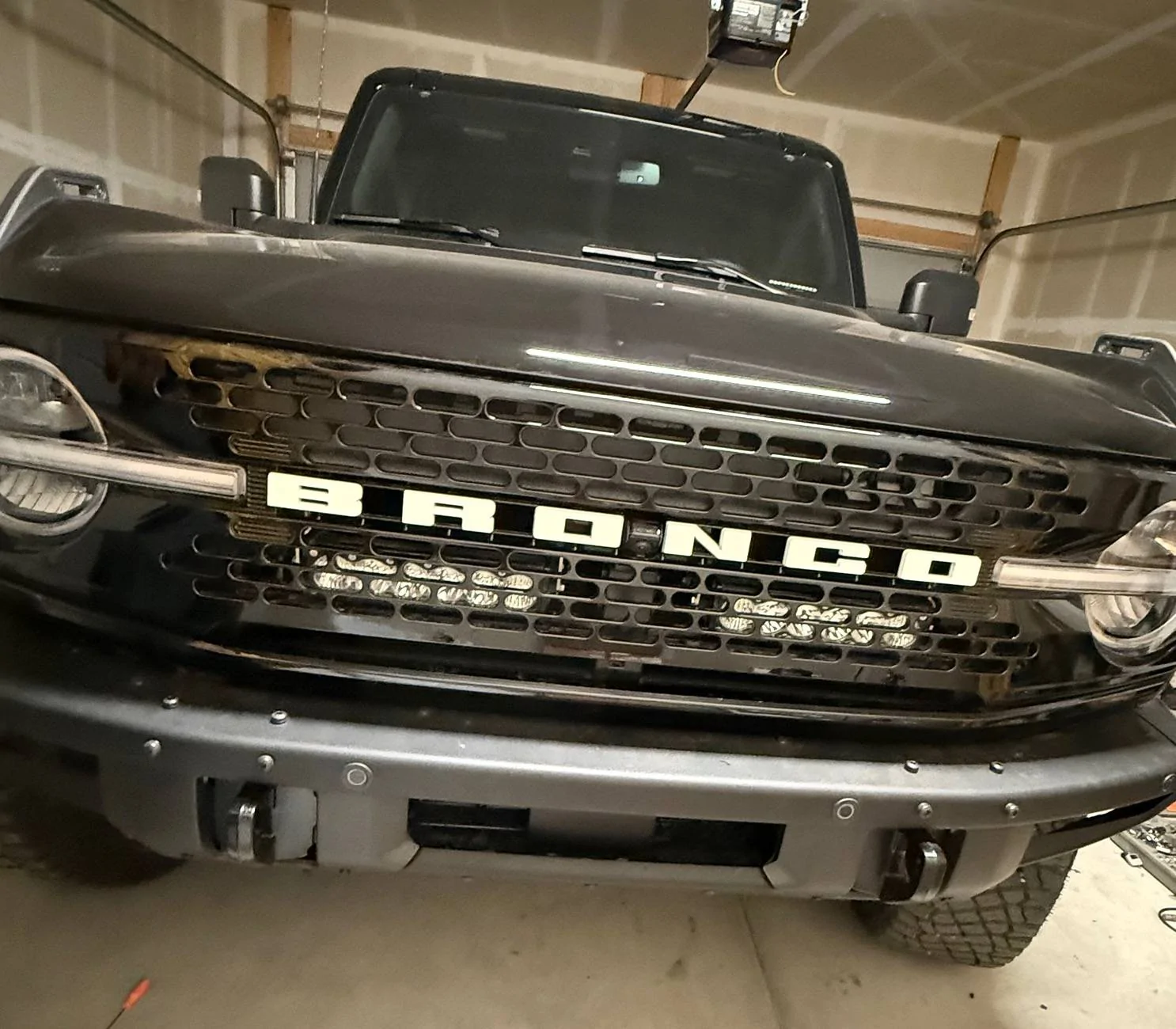 Ford Bronco Baja Designs Onyx6 10” light bars mounted behind the grill IMG_6089