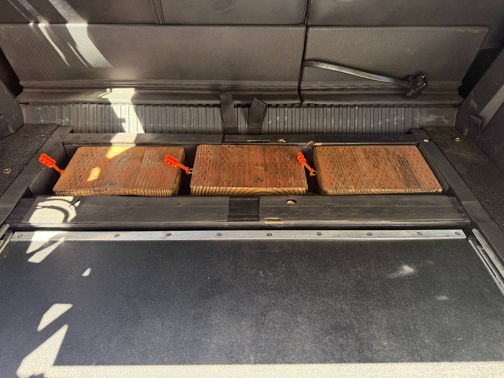 Ford Bronco Slide out table, refrigerator tray & jack block stash - custom cargo build. I need to stop watching Contraband: Seized at the Boarder. IMG_8679