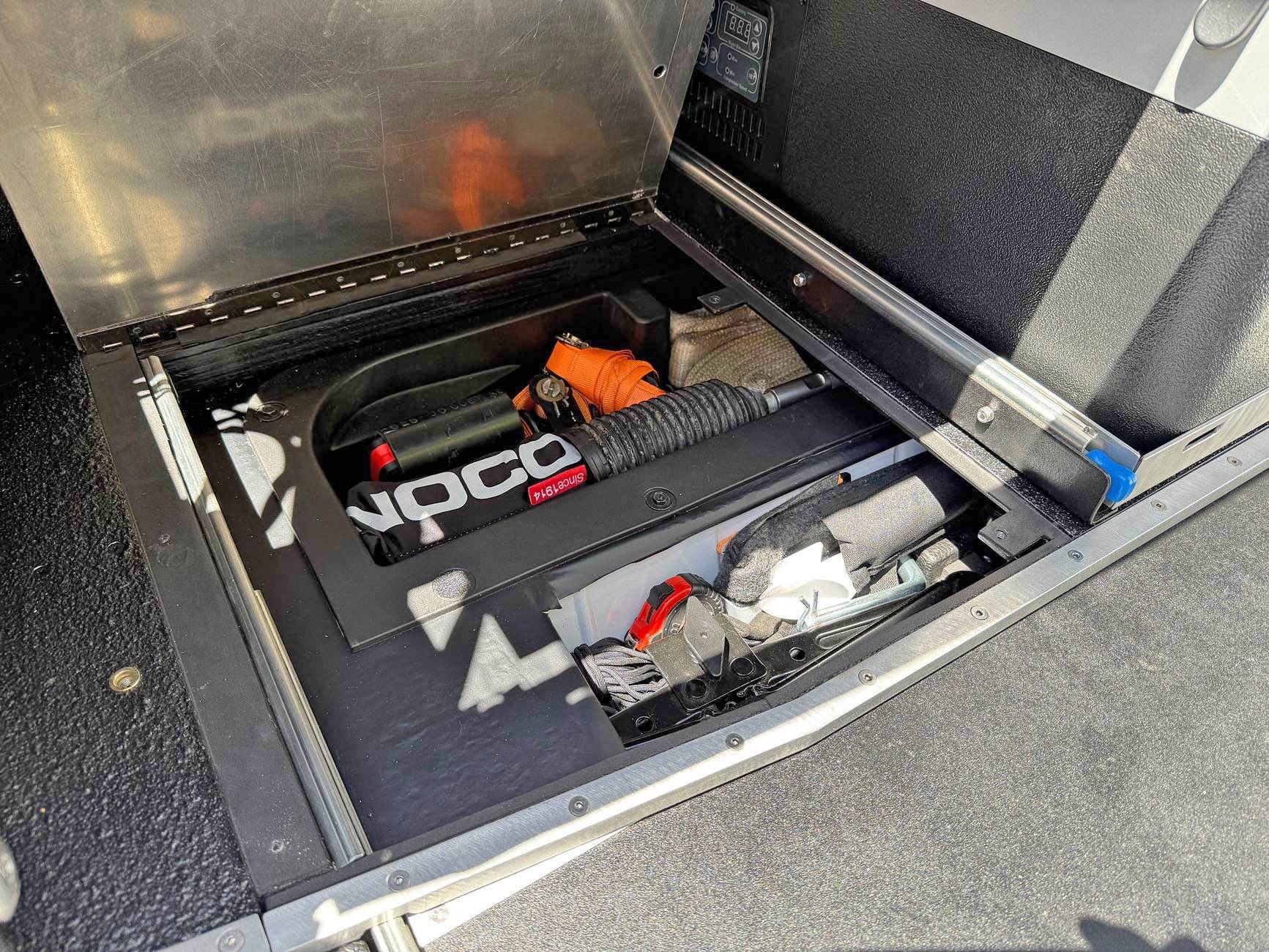 Ford Bronco Slide out table, refrigerator tray & jack block stash - custom cargo build. I need to stop watching Contraband: Seized at the Boarder. IMG_8685