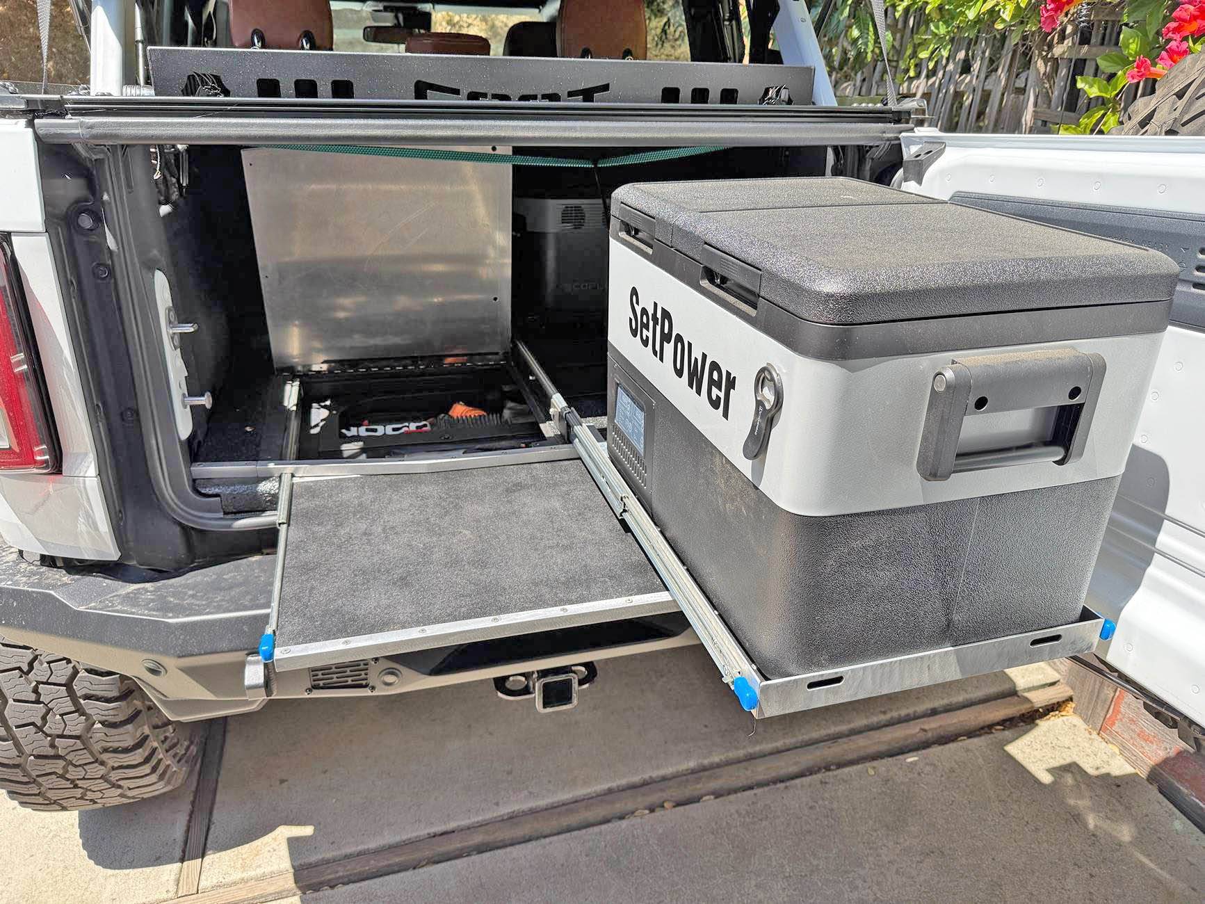 Ford Bronco Slide out table, refrigerator tray & jack block stash - custom cargo build. I need to stop watching Contraband: Seized at the Boarder. IMG_8688