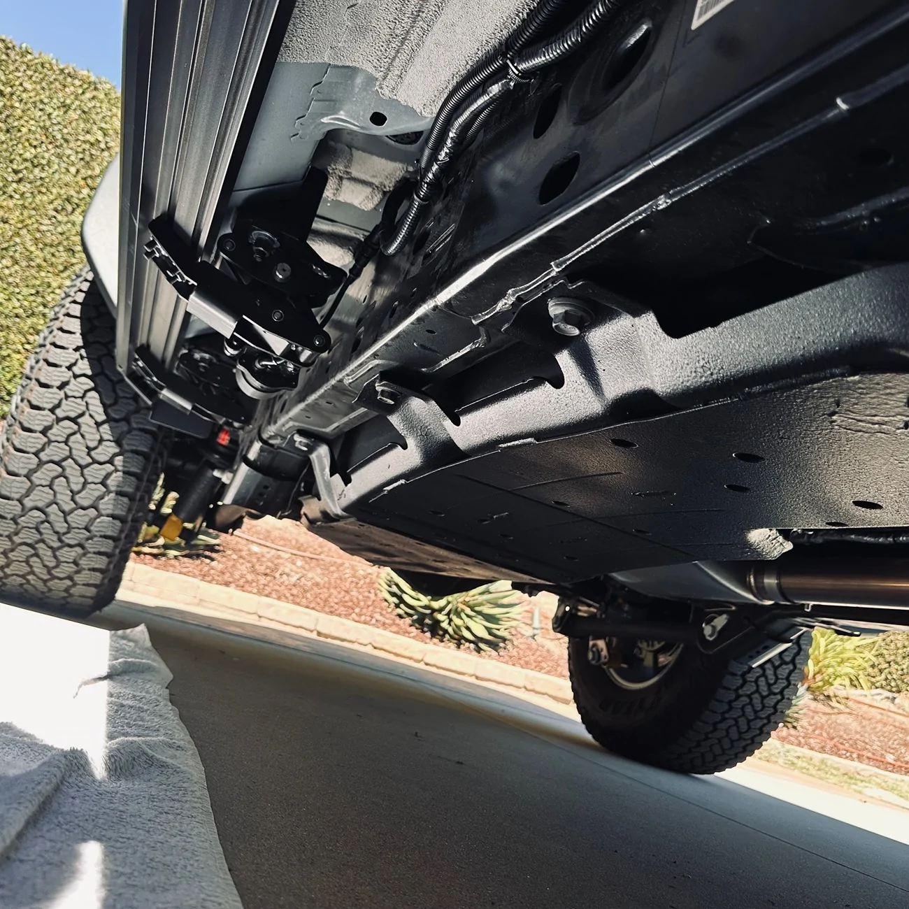 Ford Bronco Driveway install of OE Gas Tank Skid Plate on my REB Heritage 2025 Skid Plat