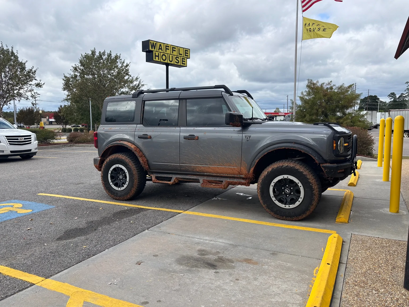 Ford Bronco Mud flaps in FRONT of back tires IMG_8005