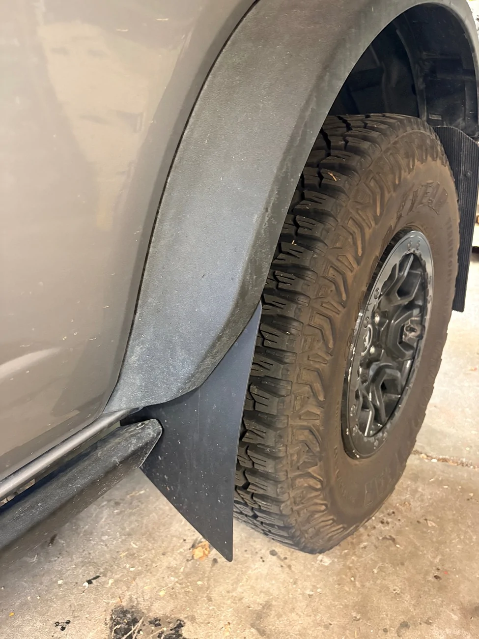 Ford Bronco Mud flaps in FRONT of back tires IMG_4901
