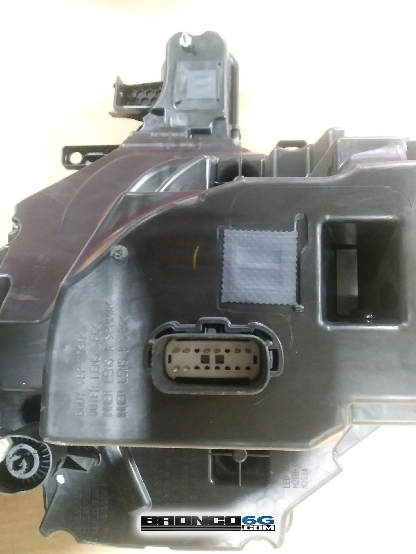 Ford Bronco 📷 Factory Broncos: Modular Black Top + Headlight Assembly, Tail Light Assembly, Puddle Lights 2021 Bronco headlight assembly unit back side pins 3