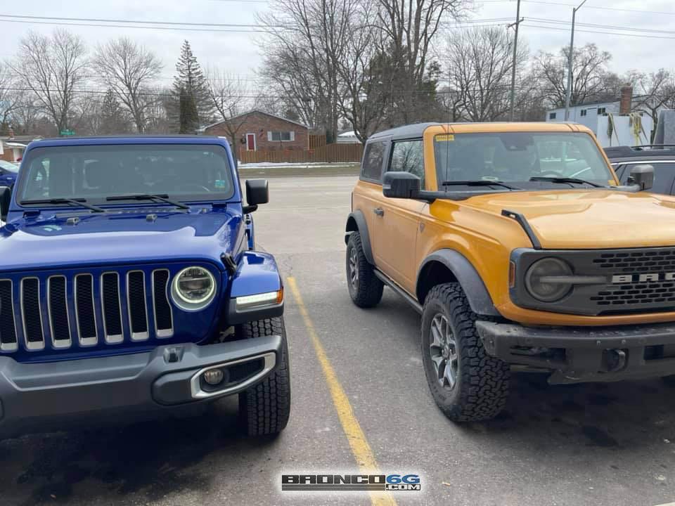 Ford Bronco Spotted: Bronco Badlands Cyber Orange vs Jeep Wrangler Sahara -- side by side 2021 Bronco 2-Door Badlands vs Jeep Wrangler 4-Door Sahara 3