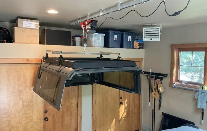 Trailrax half-rack used for hoisting 2-door hardtop roof (w/ remote electric hoist)