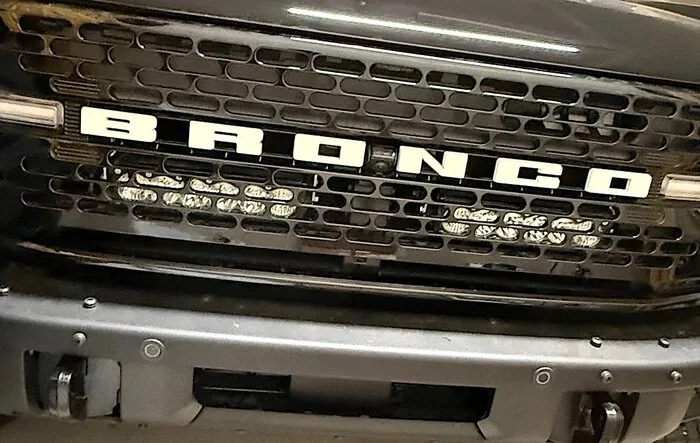 Baja Designs Onyx6 10” light bars mounted behind the grill