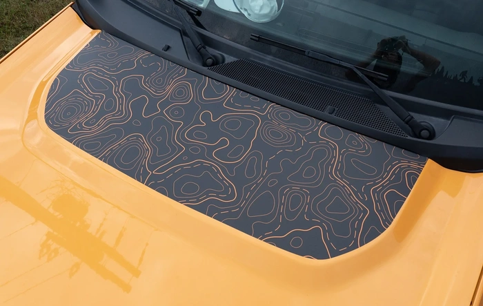 Tired of that blinding hood glare? Topography decal kit fixes it — and looks dang good doing it.