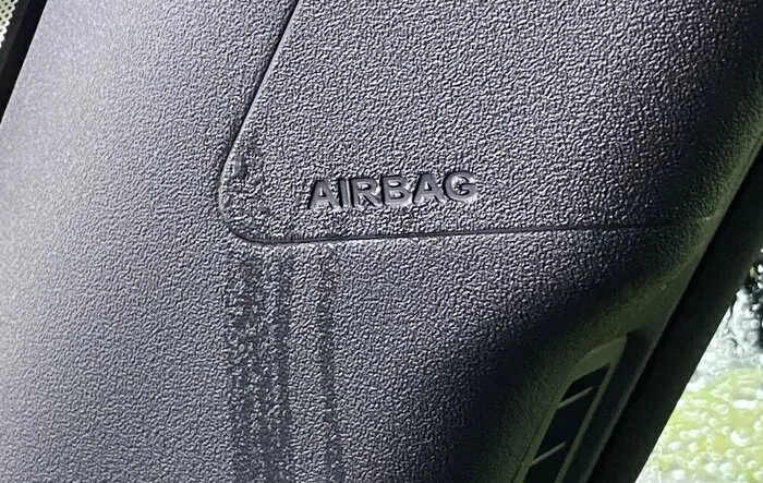 Water leaking from A-pillar airbag cover in heavy rain