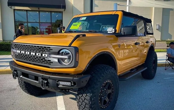 4WP Parts Fitted Bronco Badlands in Cyber Orange and on 37's