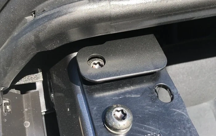 MIC top installed incorrectly by factory (front bracket mounted on top screw rather than through it)