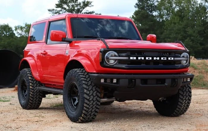 Color Matched Race Red 2-Door Big Bend with: Painted Roof + Painted Fender Flares + Gloss Black Grille + Fuel Wheels