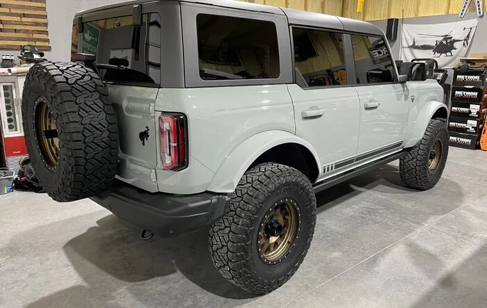 Fender flares painted on Cactus Gray First Edition + Method Wheels, Nitto Recon Grapplers 35's, Fabtech 1.5" Level Kit