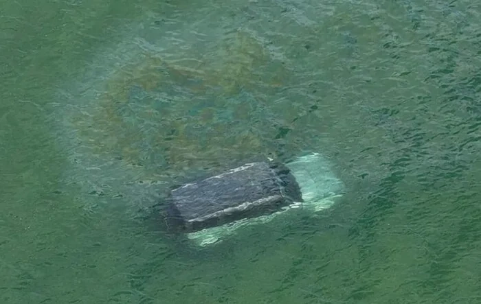 Bronco submerged in water during Maine high tide